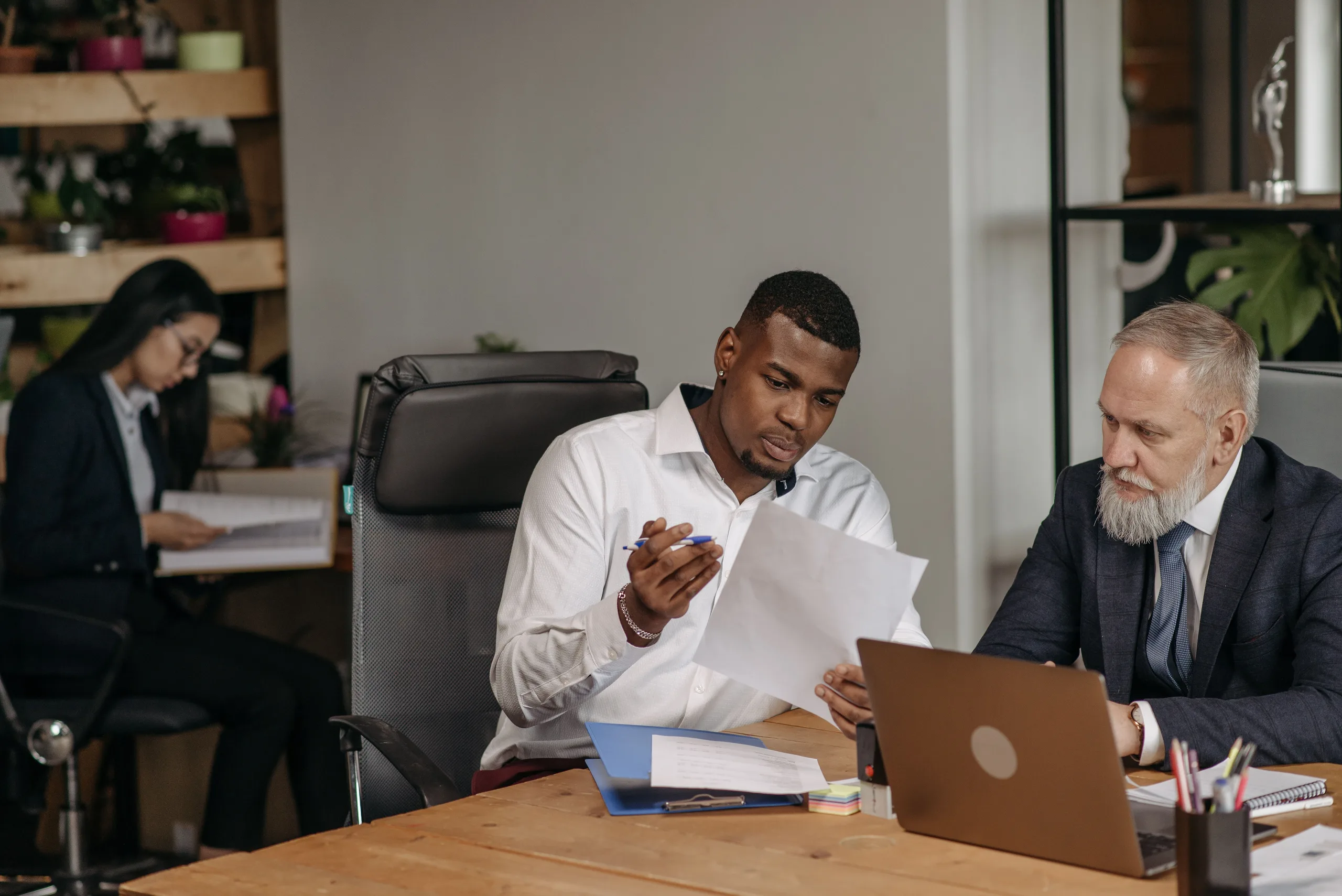 A FigsFlow migration lead and a firm&rsquo;s practice manager working through a switch plan together at an office table