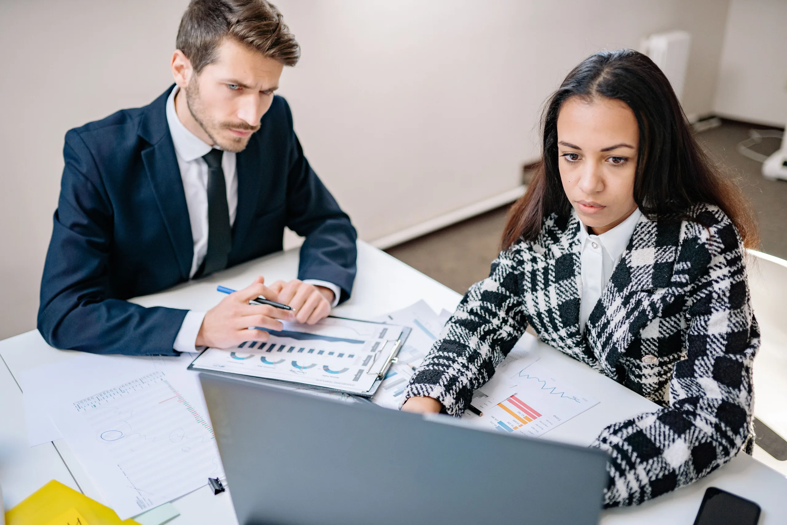 Reviewer and preparer going through a job together at the desk