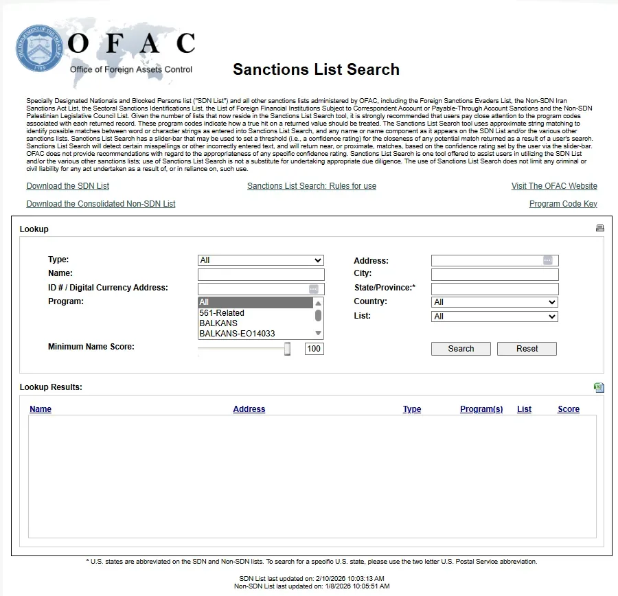 OFAC (Office of Foreign Assets Control) Sanctions List Search webpage featuring a lookup form with search fields for Type, Name, ID/Digital Currency Address, Program, Address, City, State/Province, Country, and List. The form includes dropdown menus for filtering by sanctions programs (including "561-Related" and "BALKANS" options) and a minimum name score slider set to 100. Below the form is an empty Lookup Results table with columns for Name, Address, Type, Program(s), List, and Score. The page header includes descriptive text about the SDN List and search functionality, with links to download sanctions lists and access additional resources.